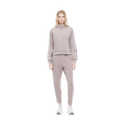Ea7 Combinaison beige en mélange de coton pour femme, fermeture éclair intégrale et fines bandes réfléchissantes, idéale pour l'automne et l'hiver.
