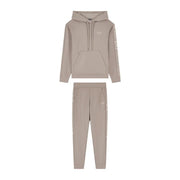 Ea7 Combinaison pantalon beige à capuche pour femme, en mélange de polyester, comprenant un sweat à capuche et un pantalon de jogging, ornée de logos blancs discrets.