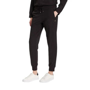 Ea7 Combinaison pantalon noire en coton à col roulé pour femme, avec pantalon de jogging noir extensible et doux, et logo discret visible sur la cuisse.