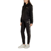 Combinaison pantalon noire à capuche pour femme ea7 Emporio Armani, en mélange de polyester, avec logo blanc sur les manches et les jambes.