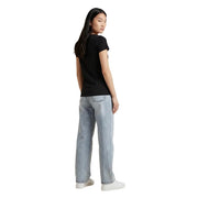 Light-wash denim jeans with a relaxed straight-leg cut paired with ea7 women cotton black short sleeve round neck t shirt