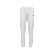 Pantalon de jogging blanc slim ea7 avec logo discret sur la cuisse, associé à une combinaison-pantalon grise en coton ea7 pour femme, col rond.