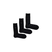 Set of three black men’s cotton socks with solid and subtle pattern designs for Fall Winter collection