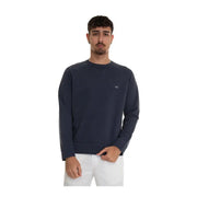 Pull en coton bleu marine à col rond de la marque Fay, orné d'un discret logo blanc brodé sur la poitrine gauche.