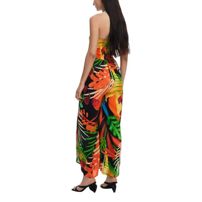 Floral print tropical halter jumpsuit displayed on a model demonstrating stylish summer fashion