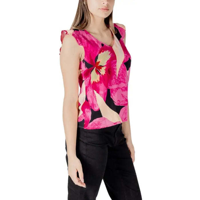 Floral print sleeveless blouse displayed on a women’s floral print sleeveless top