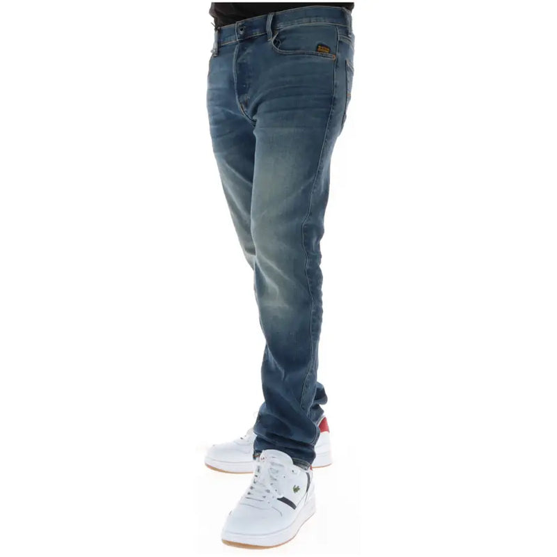 Jean G-Star pour homme, bleu, en coton stretch, modèle 51001, délavage délavé et coupe classique cinq poches.