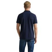 Polo en piqué de coton bleu marine à manches courtes pour homme de la marque Gant, alliant style décontracté classique et respirabilité.