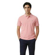 Polo homme Gant en coton stretch rose pâle, col classique, manches courtes et logo brodé sur la poitrine gauche