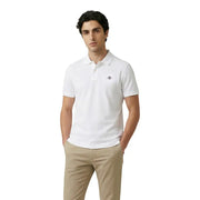 Polo blanc à manches courtes en coton stretch de la marque Gant, avec logo brodé discret sur la poitrine gauche.