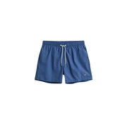 Gant men swimwear blue swim trunks with white drawstrings and small logo on lower right leg for beachwear