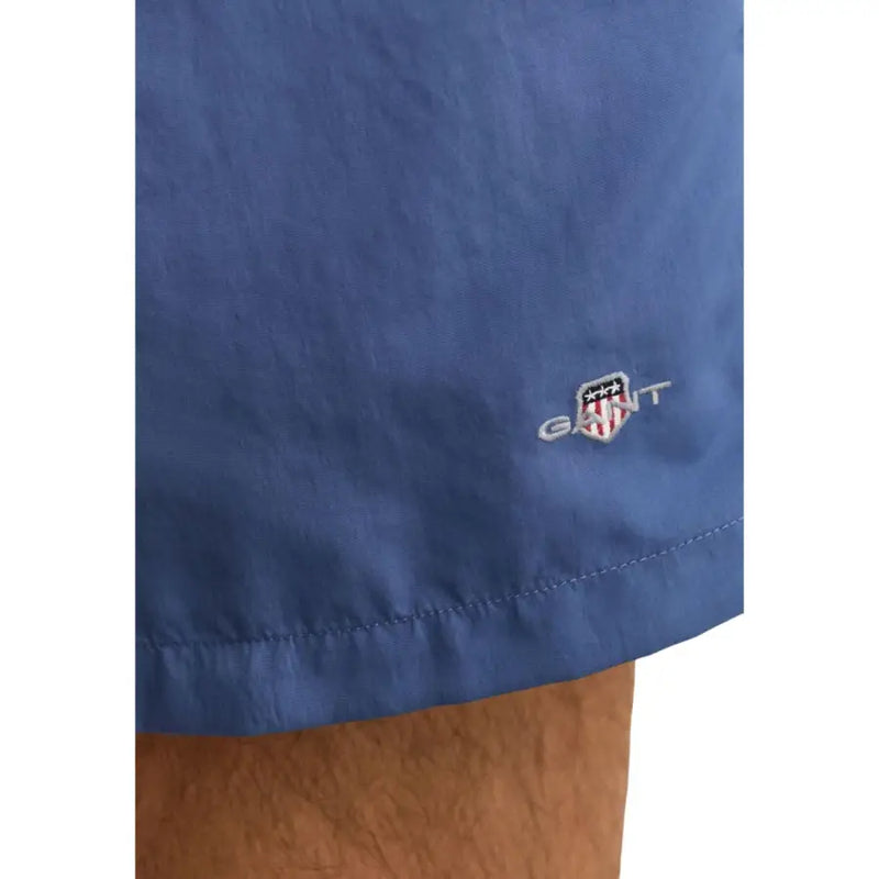 Blue Gant men swimwear shorts with subtle embroidered logo on fabric, ideal for swimming and beachwear
