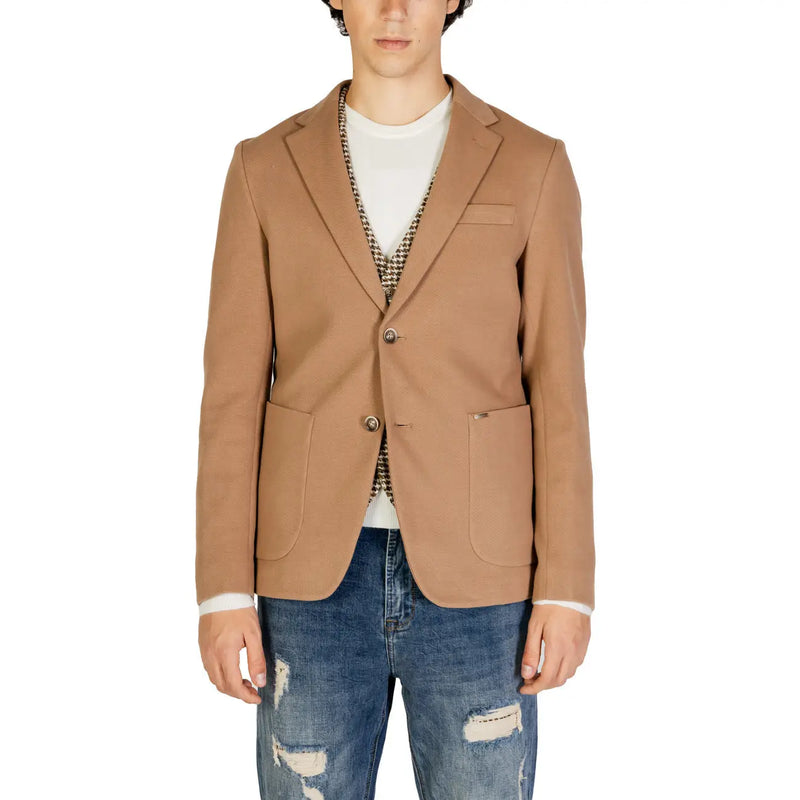 Gianni Lupo men beige cotton blazer with two front buttons and flap pockets worn over white tee and patterned vest