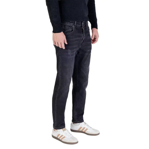 Dark wash slim fit jeans with distressed details and a classic 5-pocket design.