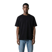 Pull ras du cou noir oversize t-shirt avec une étiquette de marque discrète en 100% coton par Gianni Lupo pour hommes