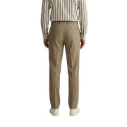 Pantalon kaki sur mesure pour homme par Gianni Lupo Confectionné en polyester viscose stretch, avec plis et coupe droite.