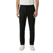 Pantalon noir à cordon de serrage, coupe droite élégante et plis discrets à la taille. gianni lupo en polyester viscose
