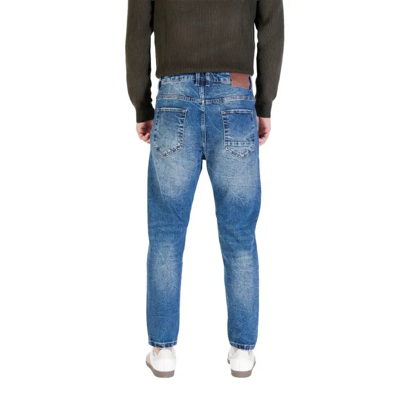 Blue denim jeans with distressed details and a straight fit.