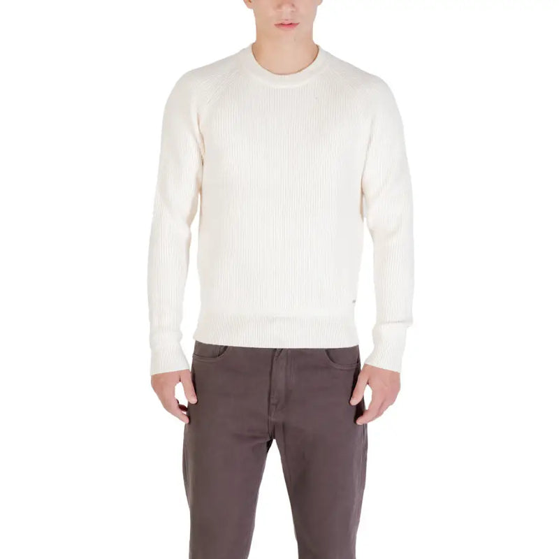 Cream-colored crew neck sweater with ribbed detailing and a classic fit.