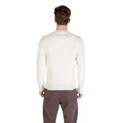 Cream-colored crew neck sweater with ribbed detailing and a relaxed fit.