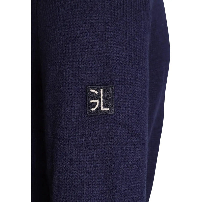 Gianni Lupo Pull en laine pour homme bleu marine foncé, manches en maille texturée et écusson brodé noir (vue de détail).