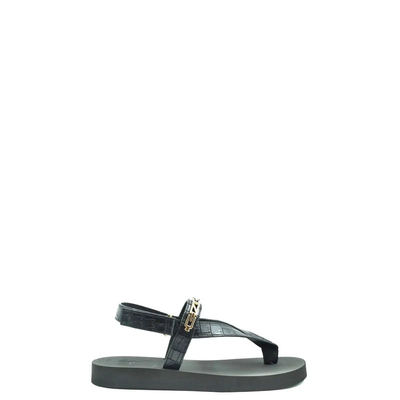 Sandales Giuseppe Zanotti pour homme, en cuir noir, avec entre-doigts en cuir façon crocodile et boucle logo dorée.