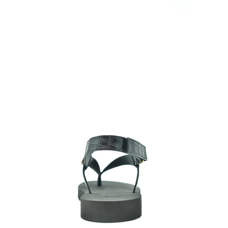 Sandales en cuir noir pour homme Giuseppe Zanotti, avec entre-doigts en cuir façon croco et semelle plateforme épaisse.