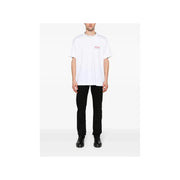 White oversized t-shirt with small red star logo paired with Givenchy men black slim fit stretch denim jeans