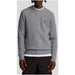 Gray cable knit sweater displayed as a stylish and comfortable winter apparel option