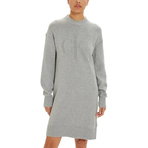 Gray knit sweater dress featuring the CK Logo for a cozy and stylish look
