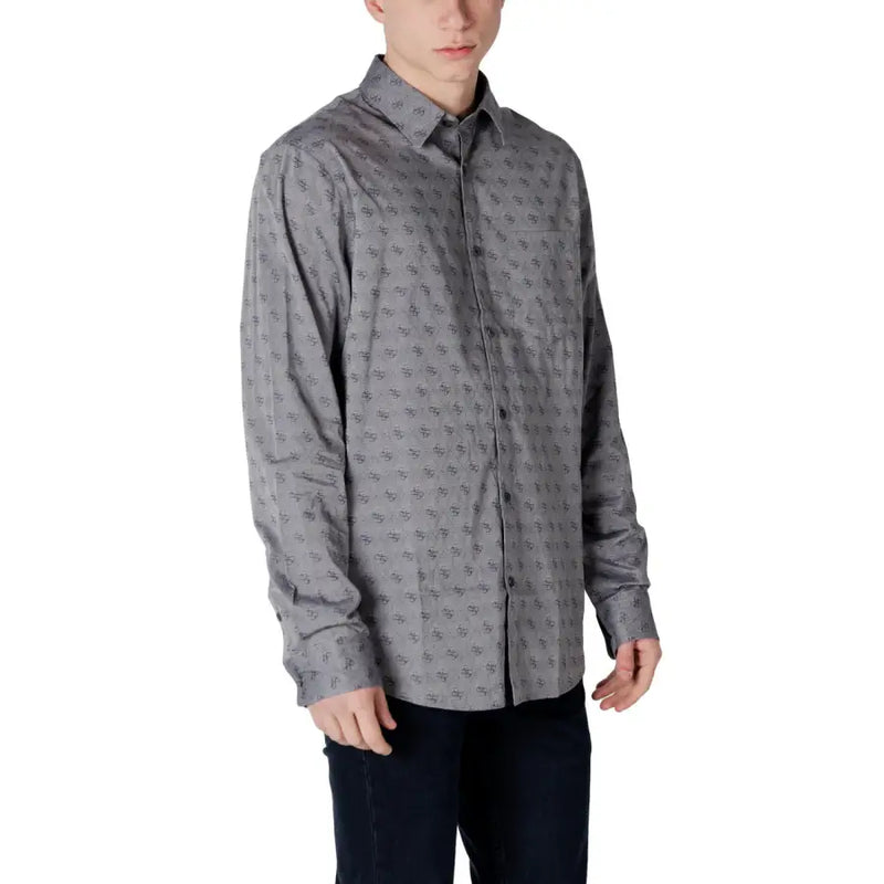 Gray patterned men’s long sleeved shirt with subtle dark geometric shapes on lightweight fabric for formal wear