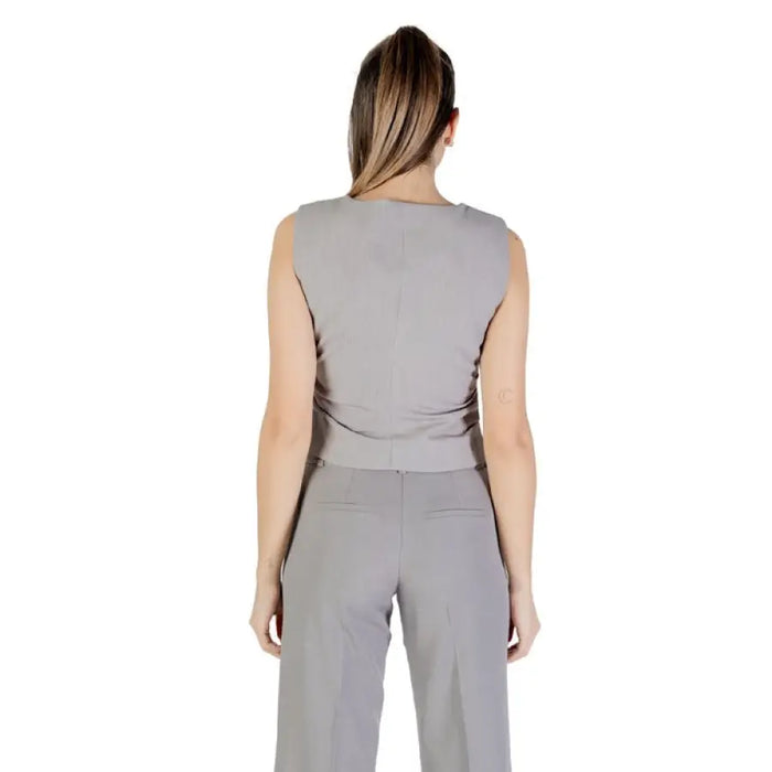 Gray sleeveless vest and pants set displayed in a stylish outfit for women