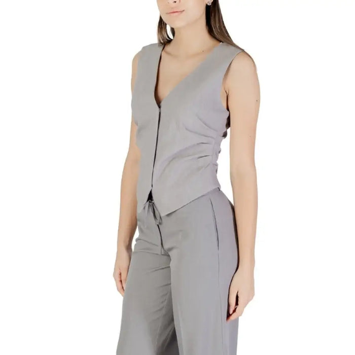 Gray sleeveless vest and matching pants set displayed in a product image