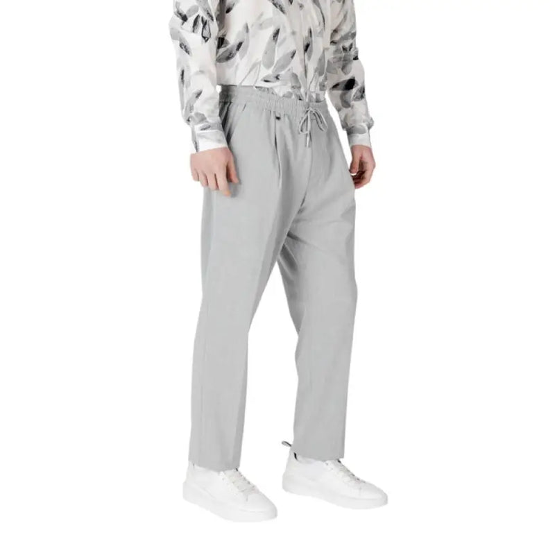 Gray drawstring trousers displayed on a mannequin showcasing comfortable casual wear