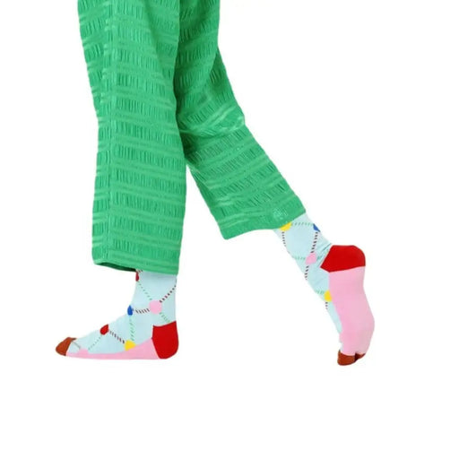Green pants paired with Colorful Patterned Socks showcasing vibrant designs