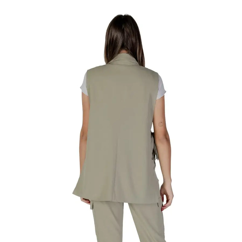 Beige sleeveless vest with collar and side pockets complementing the green sleeveless v-neck gilet by b.young