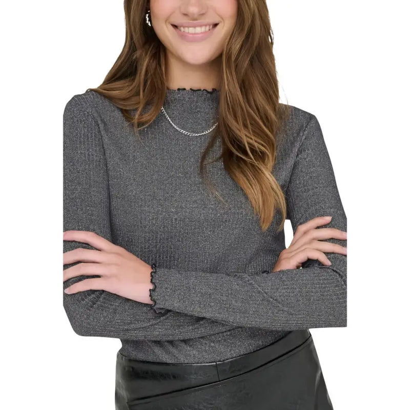 A grey long sleeve round neck cotton blend knit sweater with ribbed texture and ruffled cuffs