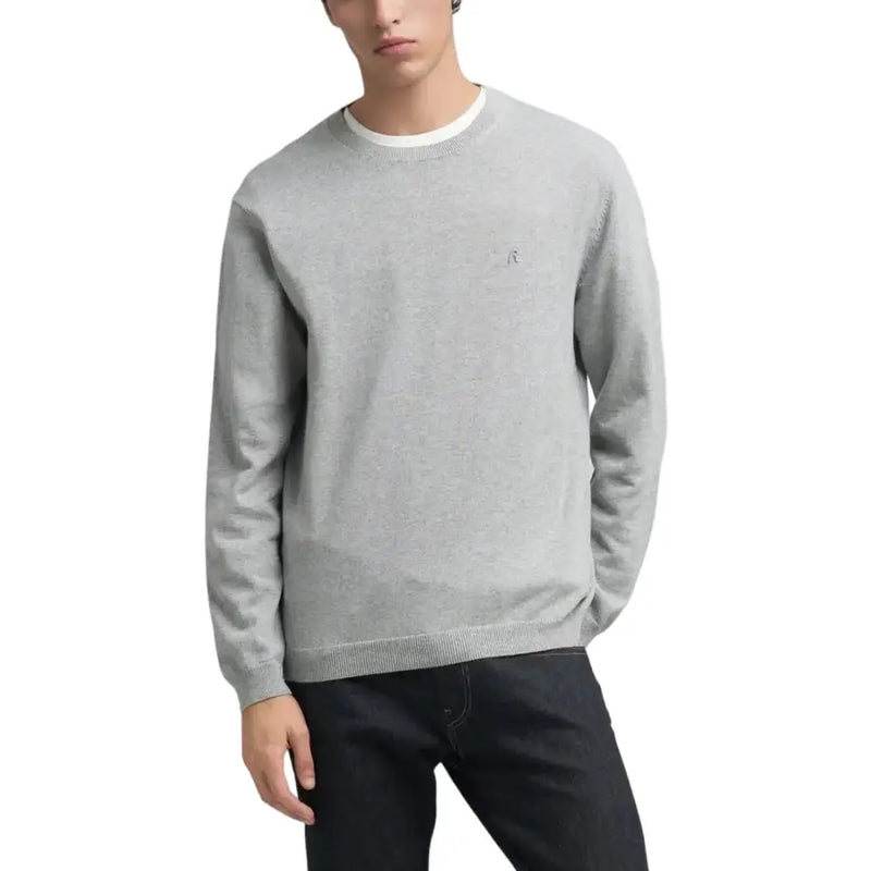 Light gray crewneck sweater with small embroidered logo on chest, made of soft cotton and polyester blend.