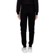 Guess active Pantalon de jogging noir en coton pour femme, avec bandes latérales blanches et motif discret, idéal pour l'automne et l'hiver.