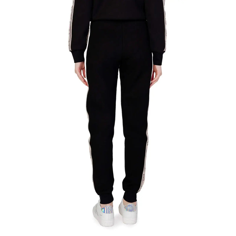 Guess active Pantalon de jogging noir en coton pour femme, avec bandes latérales blanches et motif discret, idéal pour l'automne et l'hiver.