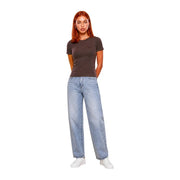 A woman wears a dark gray Guess Active brown viscose Chara short classic t shirt with light-wash wide-leg jeans