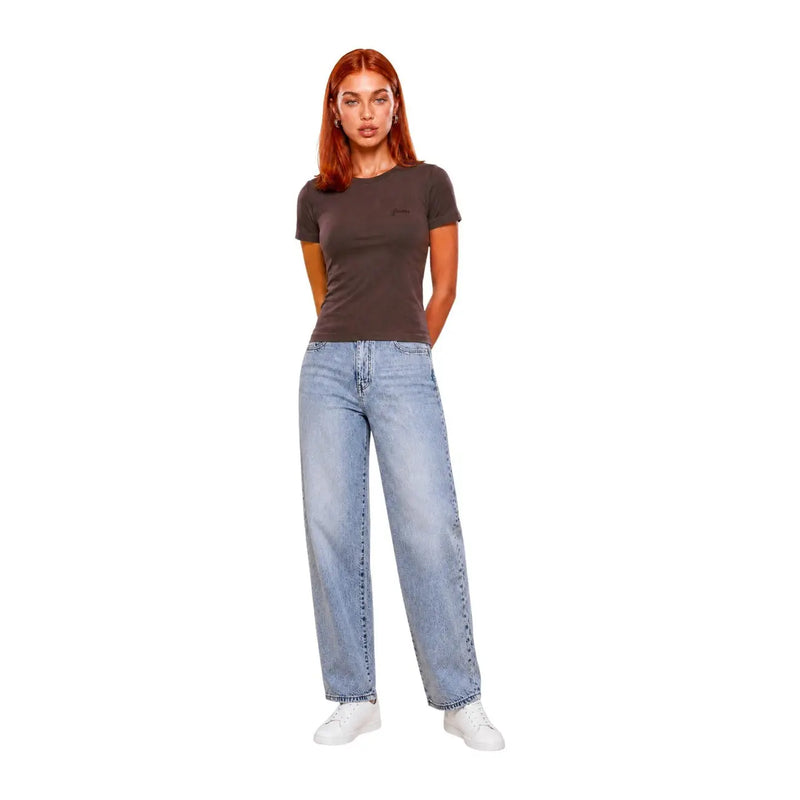 A woman wears a dark gray Guess Active brown viscose Chara short classic t shirt with light-wash wide-leg jeans