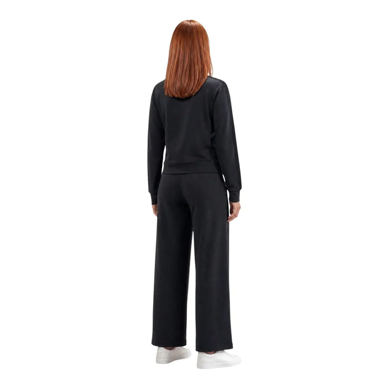 Noir guess active Pantalon droit Lyra pour femme, associé à un sweat-shirt à manches longues coupe décontractée avec poignets côtelés.