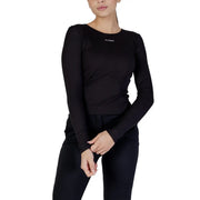 Black long-sleeved Guess top with subtle logo at neckline complementing the white modal round neck T shirt