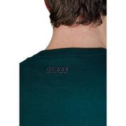 Dark green guess men knitwear tech stretch t-shirt with a subtle embroidered logo at the neckline in viscose blend