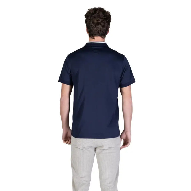 bleu marine Guess Polo homme à col blanc en coton et manches courtes, idéal pour une tenue décontractée.