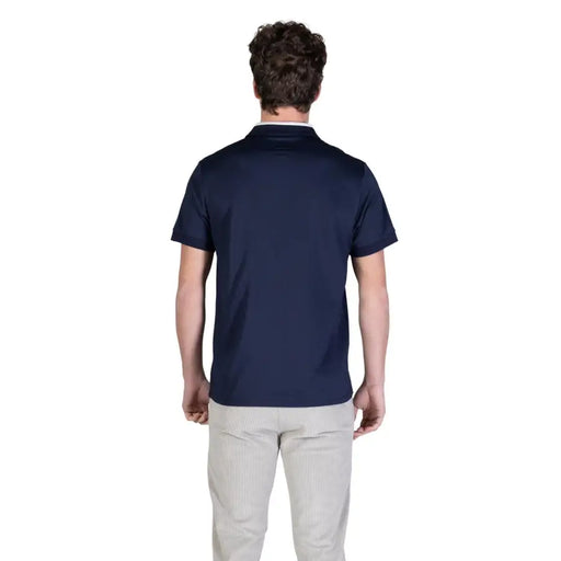 bleu marine Guess Polo homme à col blanc en coton et manches courtes, idéal pour une tenue décontractée.