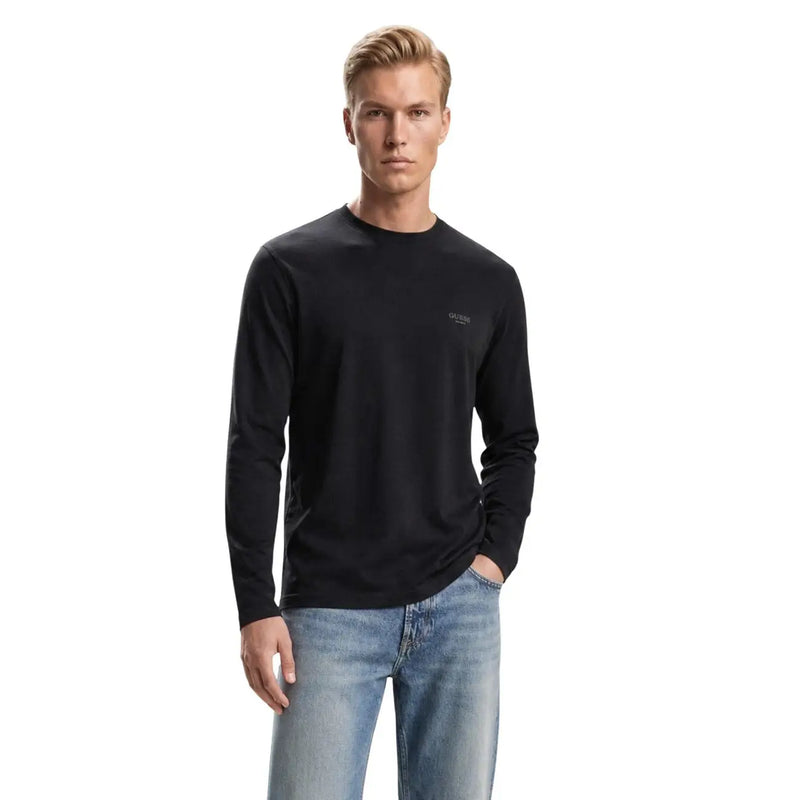 T-shirt noir à manches longues et col rond en coton avec logo brodé discret sur la poitrine gauche. Guess coupe slim pour homme