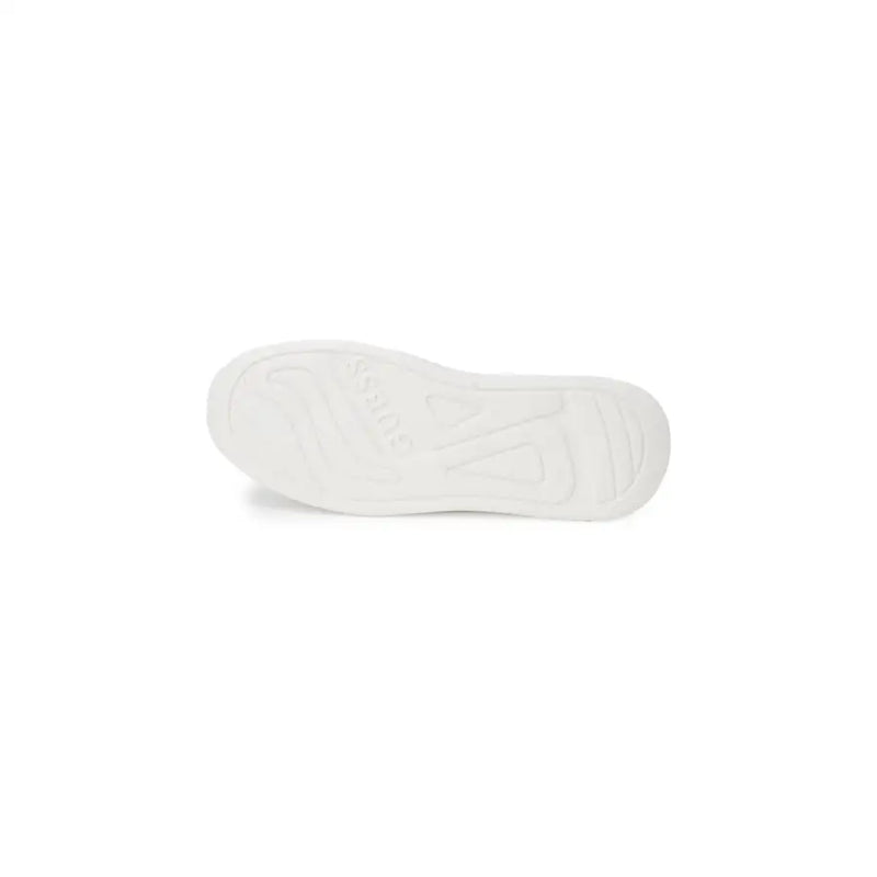 Guess men’s white leather sneakers with white rubber sole embossed logo and textured tread pattern visible