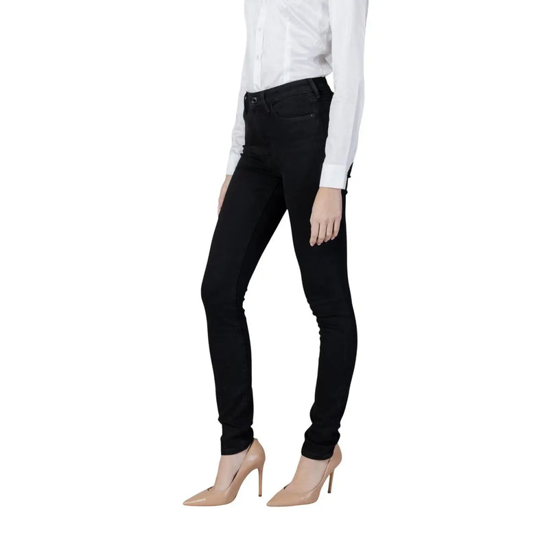 Guess Jean en denim stretch noir en coton pour femme, coupe skinny taille haute et silhouette élégante.